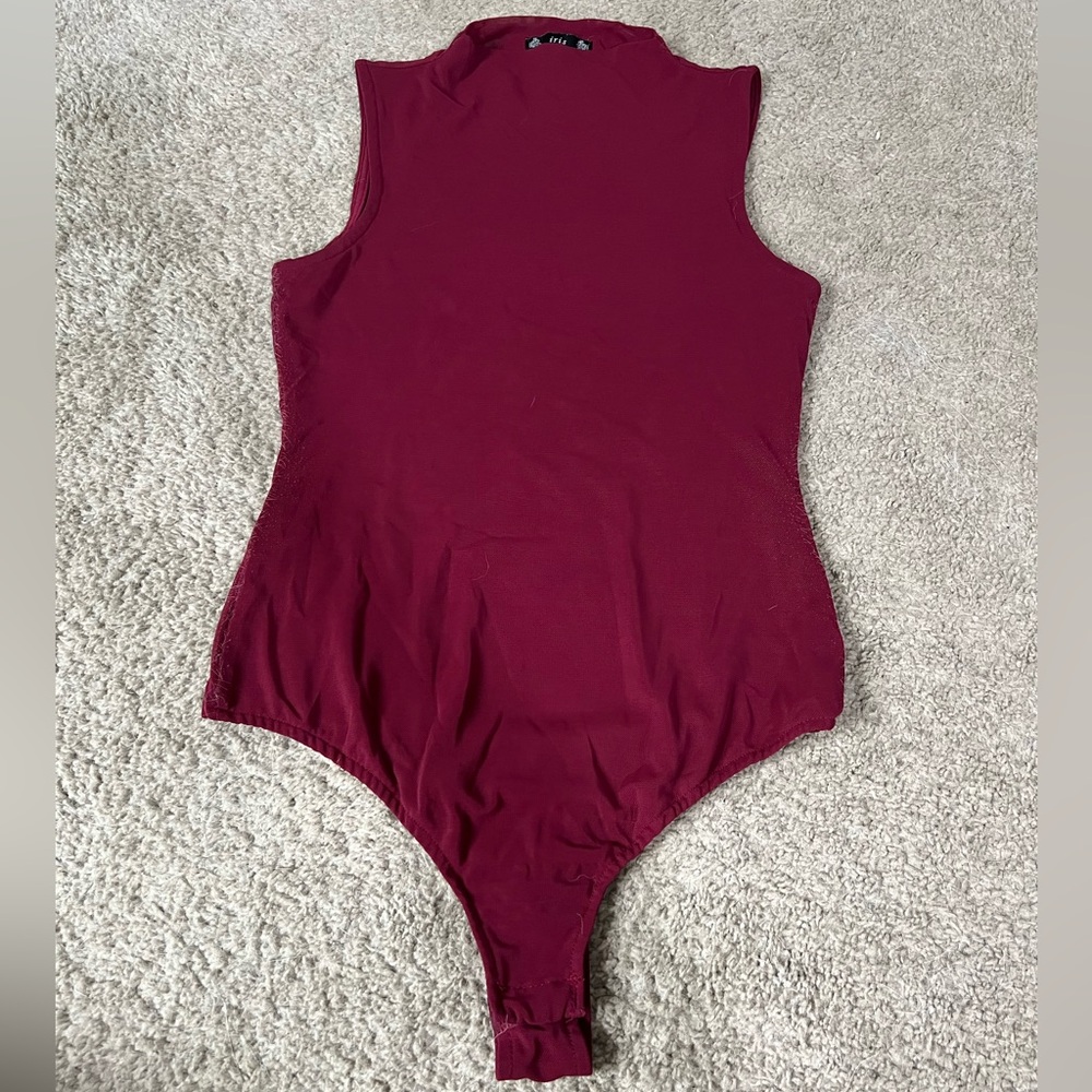 Red sleeveless one piece.